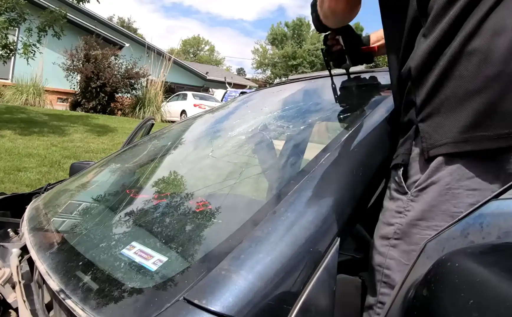 Hail damaged windshield before replacement in Greeley